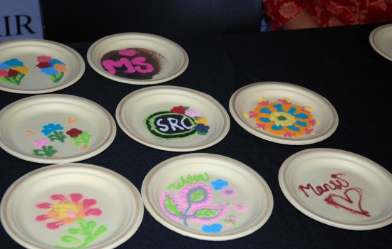 Rangoli station with sand art on paper plates 