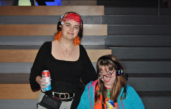 2 students wearing headphones in the SLC