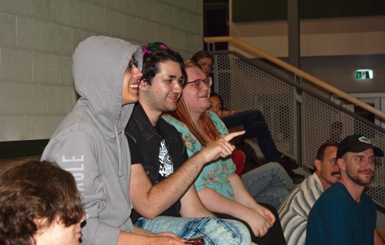 Crowd shot of smiling students sitting in the SLC tiered seating