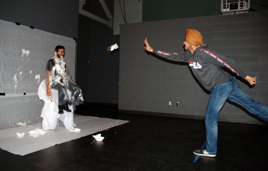 SRC Director Pratham throws a pie at SRC President, Rishi