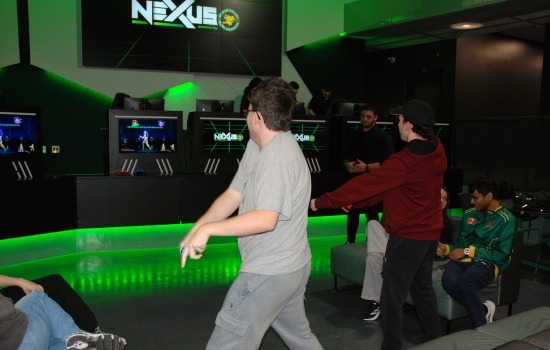 2 students playing Just Dance in the Nexus