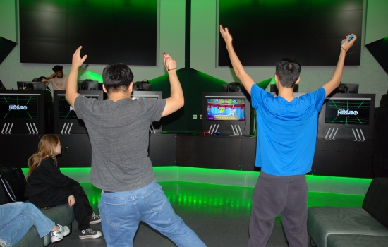 2 students playing Just Dance in the Nexus