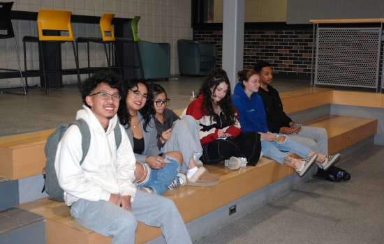 A group of students sitting on tiered seating in the SLC