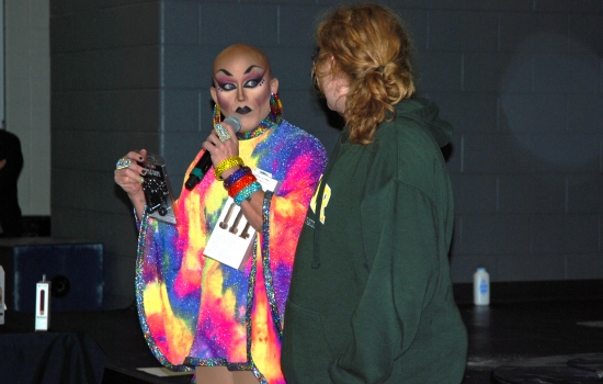Sabin speaks to a student through the microphone