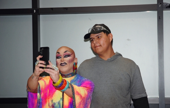 A student poses for a photo with Sabin