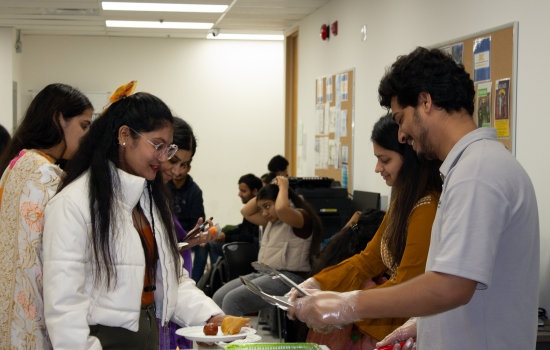 Students in line being served snacks