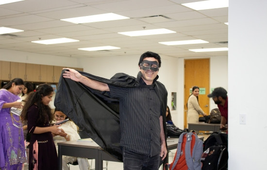A student in a superhero halloween costume