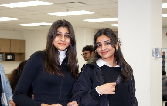 Two students dressed for halloween with fake blood on their faces