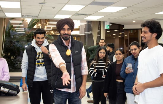 A student takes his shot while others watch