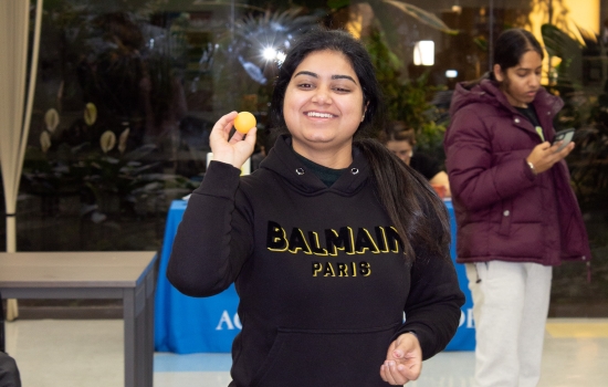 A student prepares to take her shot