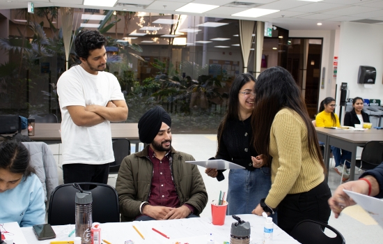 Students laughing and smiling at the event