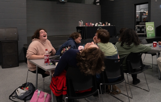 A table of students laughing