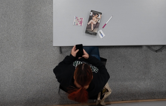 An arial view of a student with their prize on the table