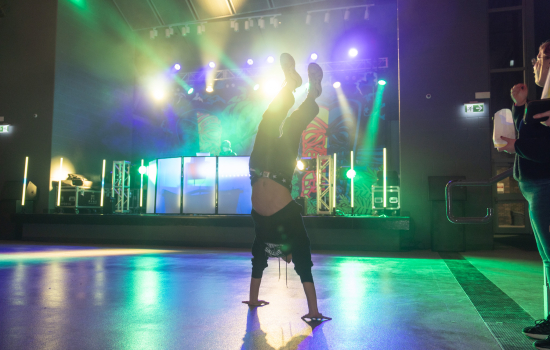 A student does a handstand in the SLC
