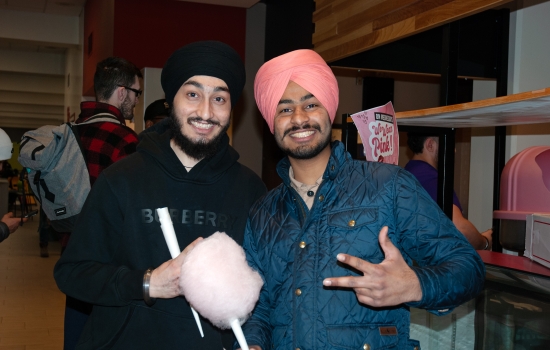 Smiling students pose with their cotton candy
