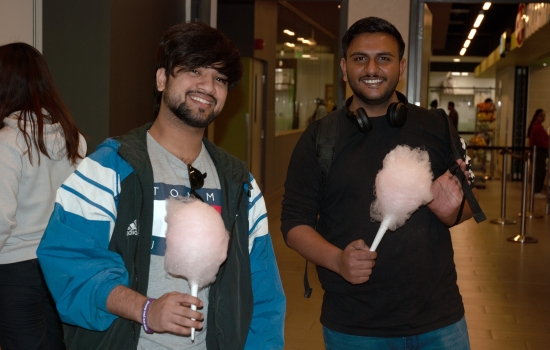 Smiling students pose with their cotton candy