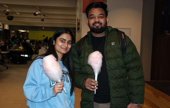 Smiling students pose with their cotton candy