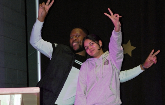 MC's throw up peace signs 