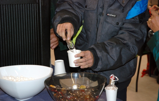 A student adds marshmallows to their beverage