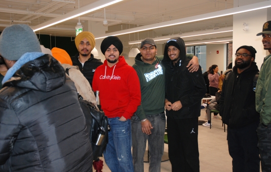 A group of students pose while they wait in line for hot chocolate