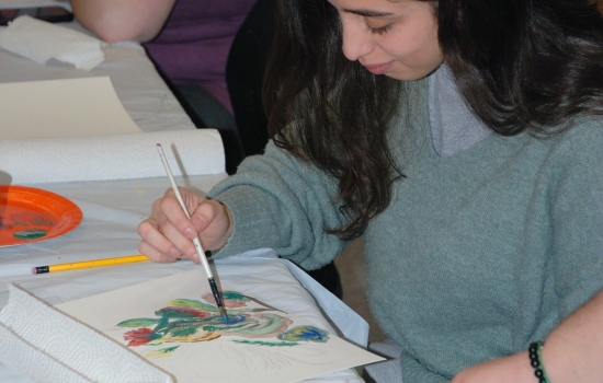 A student works on their painting