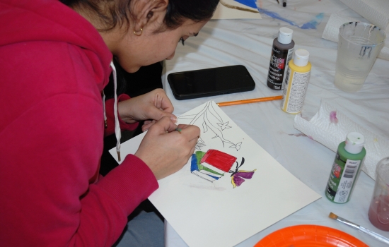 A student works on their painting