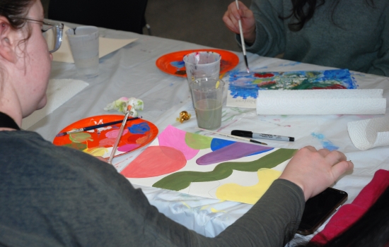 A student works on their painting