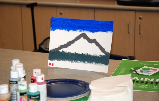 A painting of a mountain signed H.K.