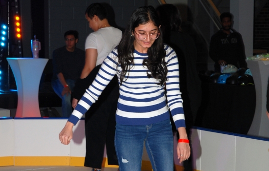 A student skates around the SLC