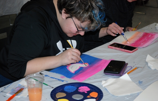 A student works on their painting
