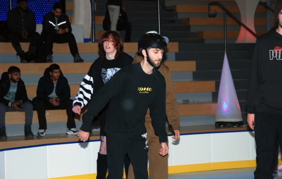 A student skates around the SLC