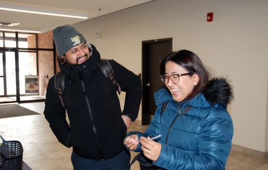 Students laugh together at the event