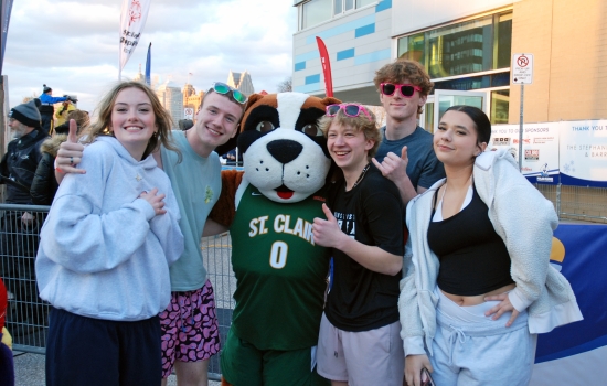 Plungers pose with St. Clair's beloved mascot, Griff