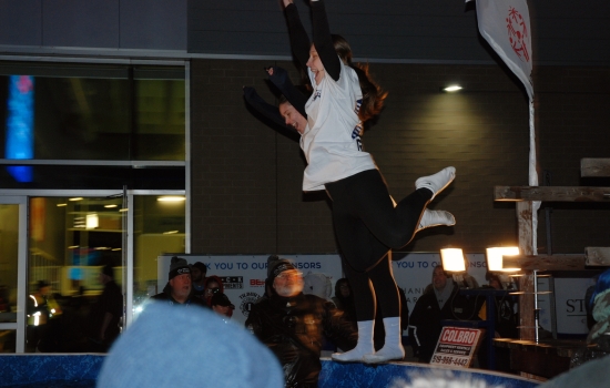 Two plungers prepare to jump into the icy waters