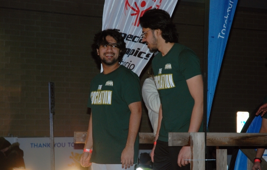 Two plungers in SSAA shirts prepare to jump