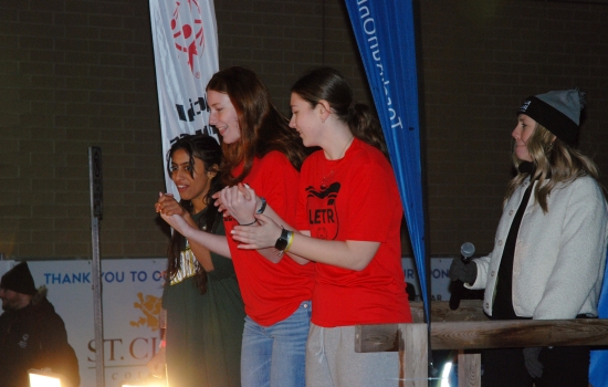 Two plungers in red shirts prepare to jump