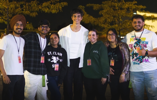 The 2025-26 SRC Board smiles with Elijah Woods
