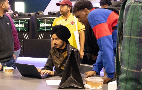 Pratham works on a laptop during the event