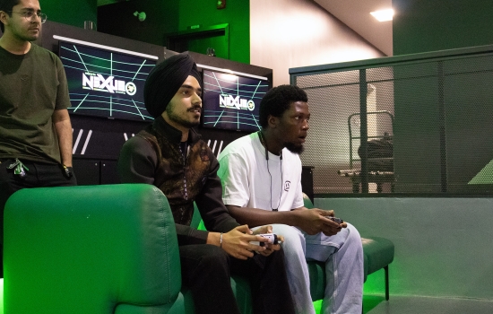 Pratham plays FIFA against students in the Esports Nexus