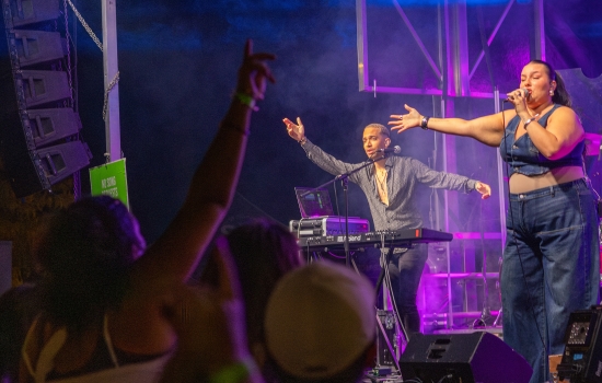 Nicolina performs on stage in front of a crowd