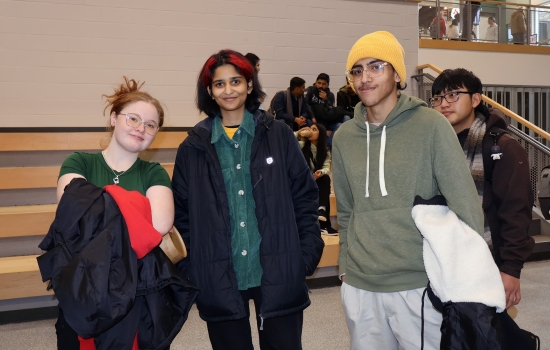A group of 3 students wait for their turn 