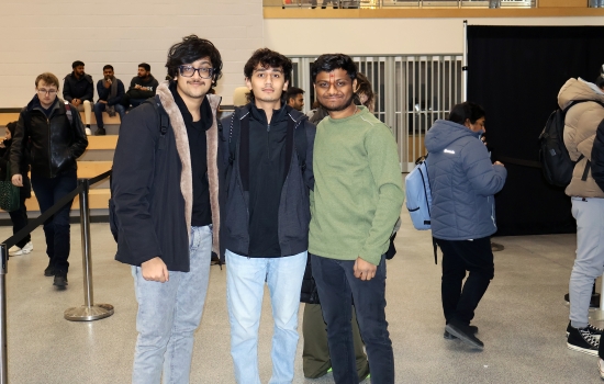 Three students wait their turn for a reading