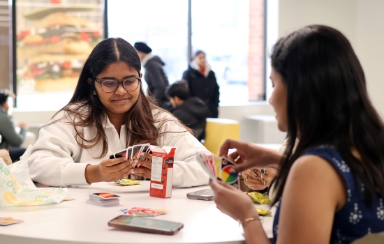 Two students play a game of UNO