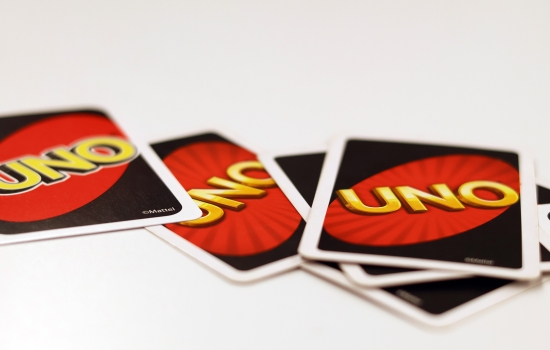 A close up of uno cards on a table