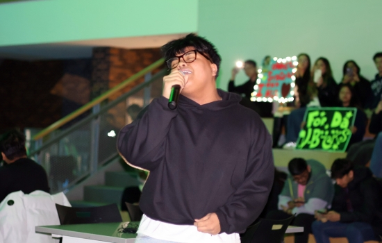 A contestant heads into the crowd and sings
