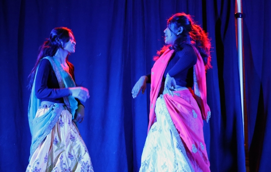 A group of two contestants perform a dance on the SLC stage