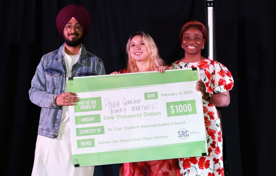 Our top 3 winners smile and pose with the giant cheque