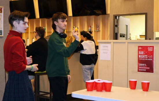 Two students play lemonade pong