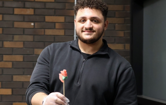 Ali holds up a sour candy rose