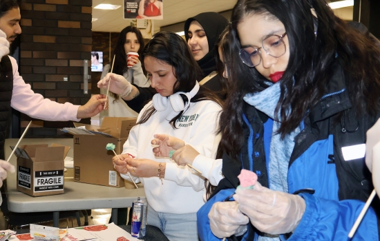 Students crafting sour candy roses